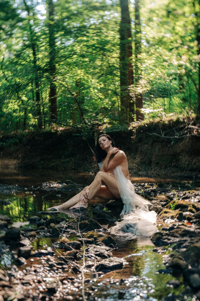 This fine art boudoir gallery is a celebration of the divine feminine—an exploration of softness, power, and presence. Photographed exclusively on 35mm, 120mm medium format, and Polaroid film, each image reflects the timeless beauty of analog photography and the tactile intimacy it brings. This is more than a photoshoot—it’s a luxury, high-touch experience designed for women who are ready to reconnect with their bodies, creativity, and sense of self.  Captured by Kristen Hammock, a Durham, NC fine art boudoir photographer specializing in emotional, film-based portraiture that centers the female gaze and honors every phase of womanhood.