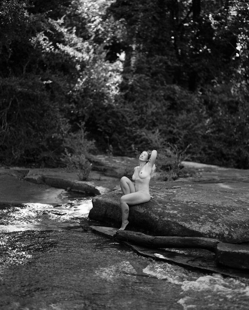 Woman sitting in golden morning light, fine art film boudoir photography by Kristen Hammock Durham NC
